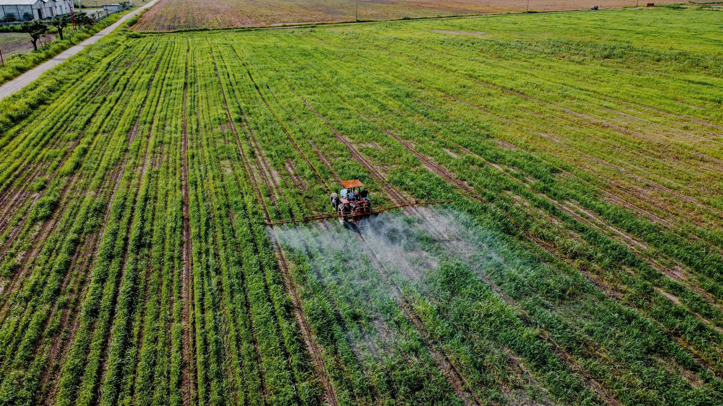Aerial view of agricultural equipment working a field