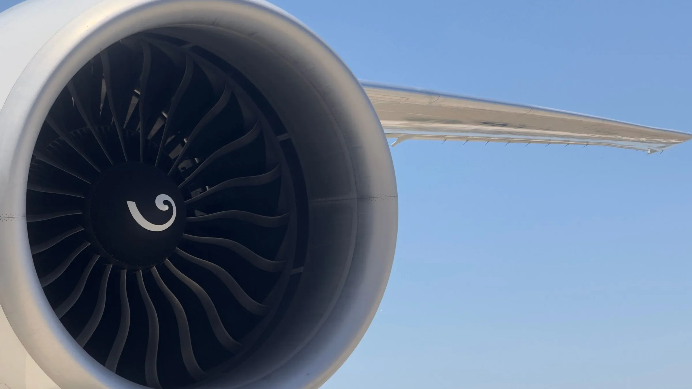Close-up of an aircraft jet engine and wing