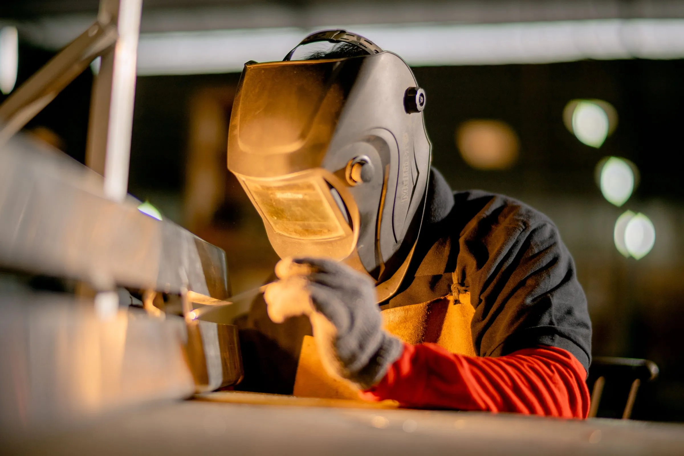 Skilled welder at work in a fabrication workshop